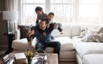 two little boys having fun with their father at home
